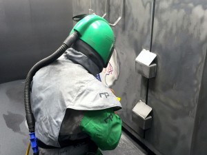 Sandblasting in the booth
